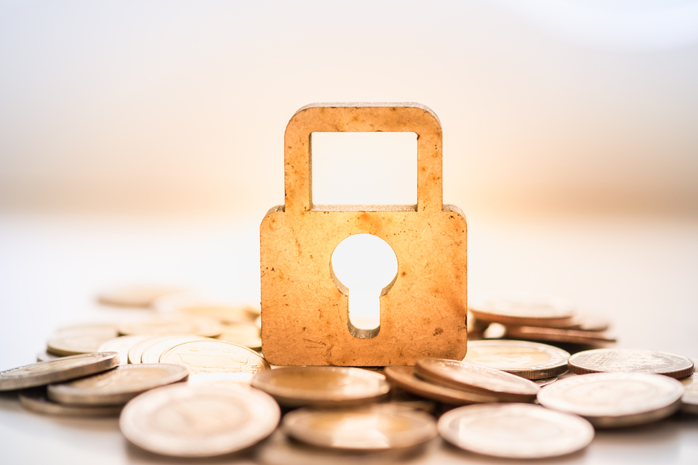 Image of lock sitting on top of change