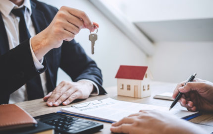 guy handing key to client